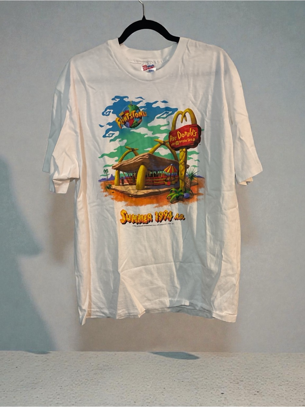 Vintage McDonald's White Tee with Multicolor Flintstones Beach Graphic